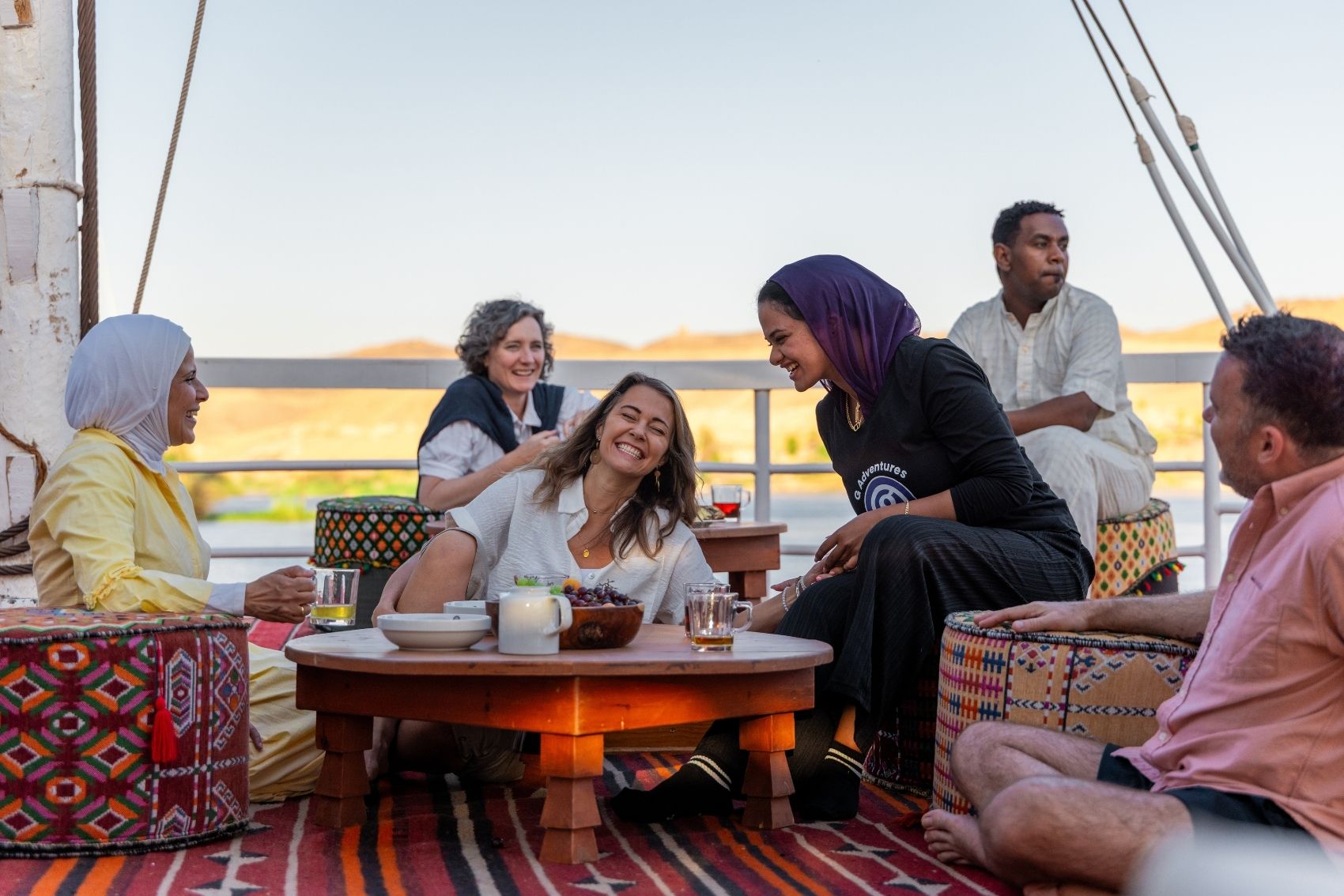A picture of Haidy Abdelmaqsoud, the first female CEO for G Adventures, with a tour group in Egypt