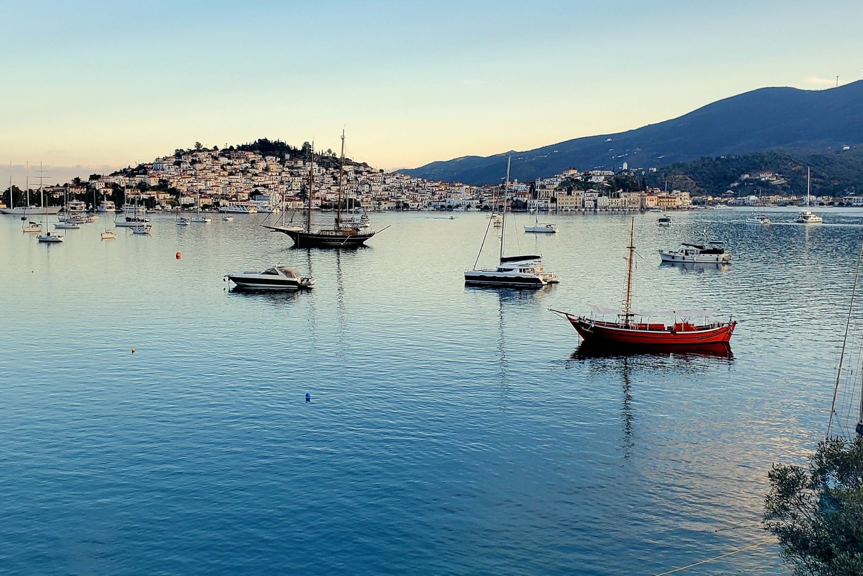 Boats pictured at sunset in Poros Island in Greece