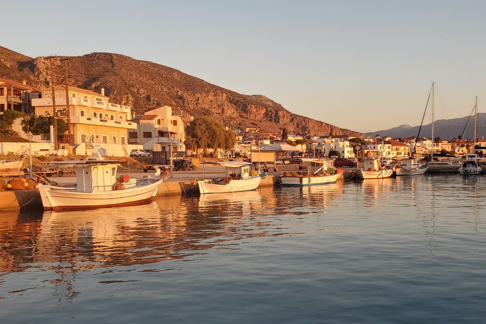 Boats at sunset in the harbour of Poros Island in Greece