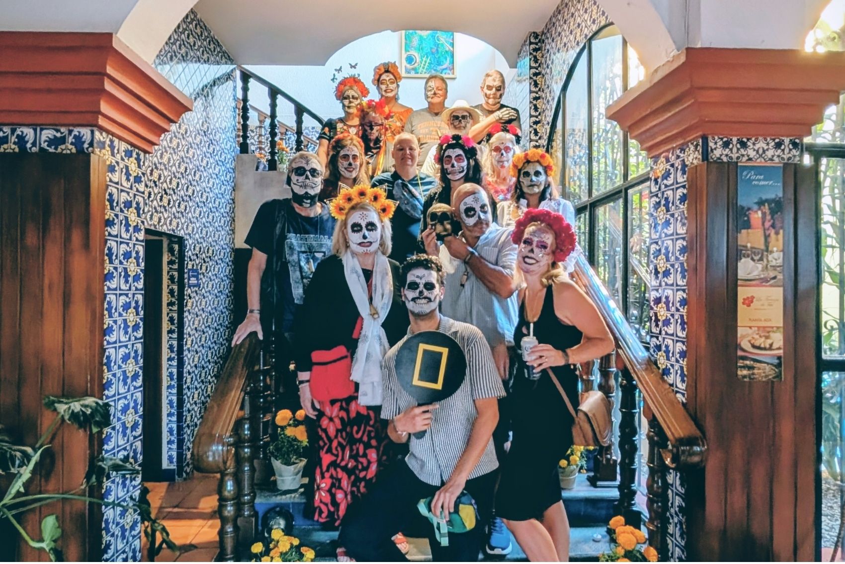 A group of travellers posing for a photograph at Oaxaca’s Day of the Dead