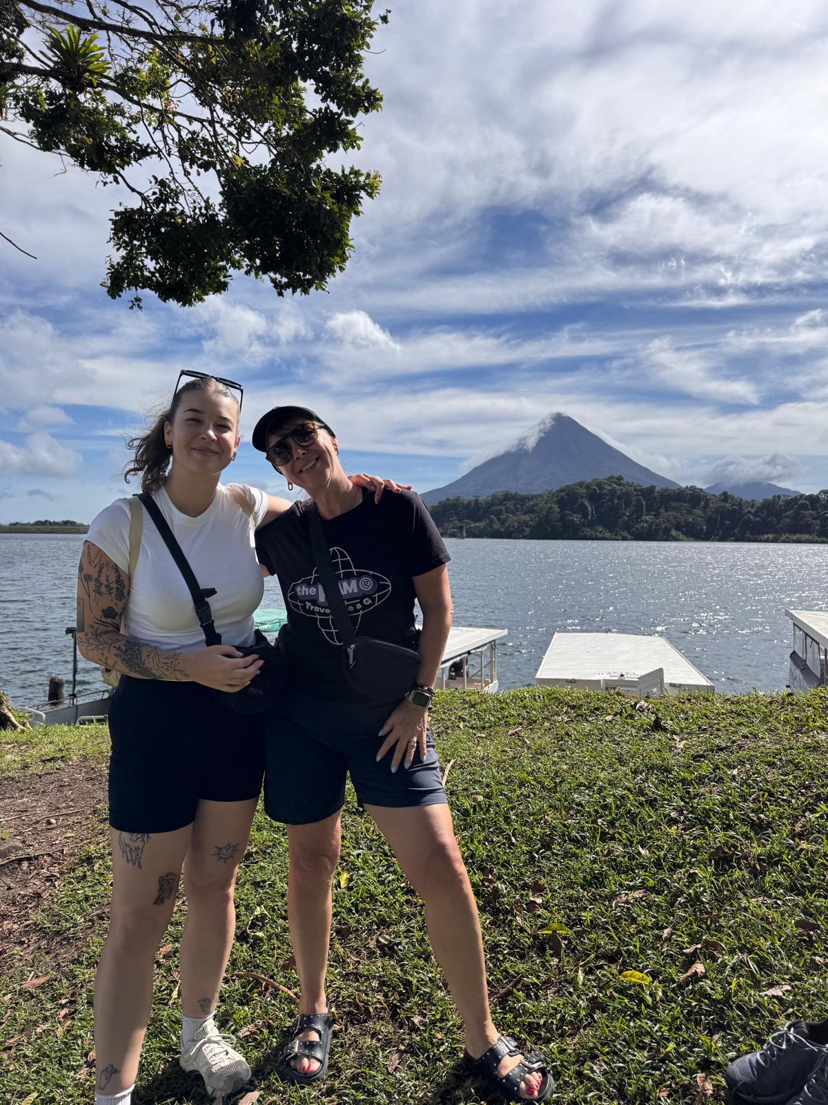 Debbie Bowman and her daughter Amanda posing in front of a volcano in Costa Rica