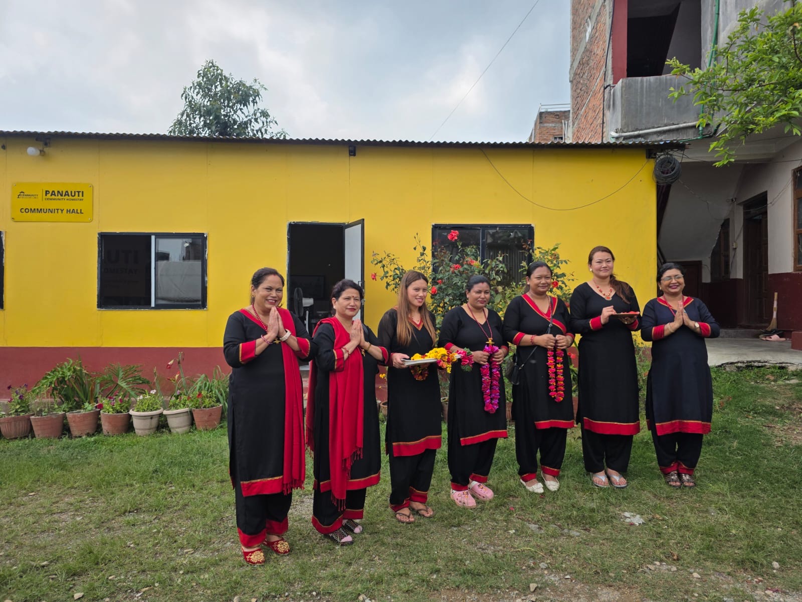 A line of women in traditional Nepal dress at the Panauti homestay