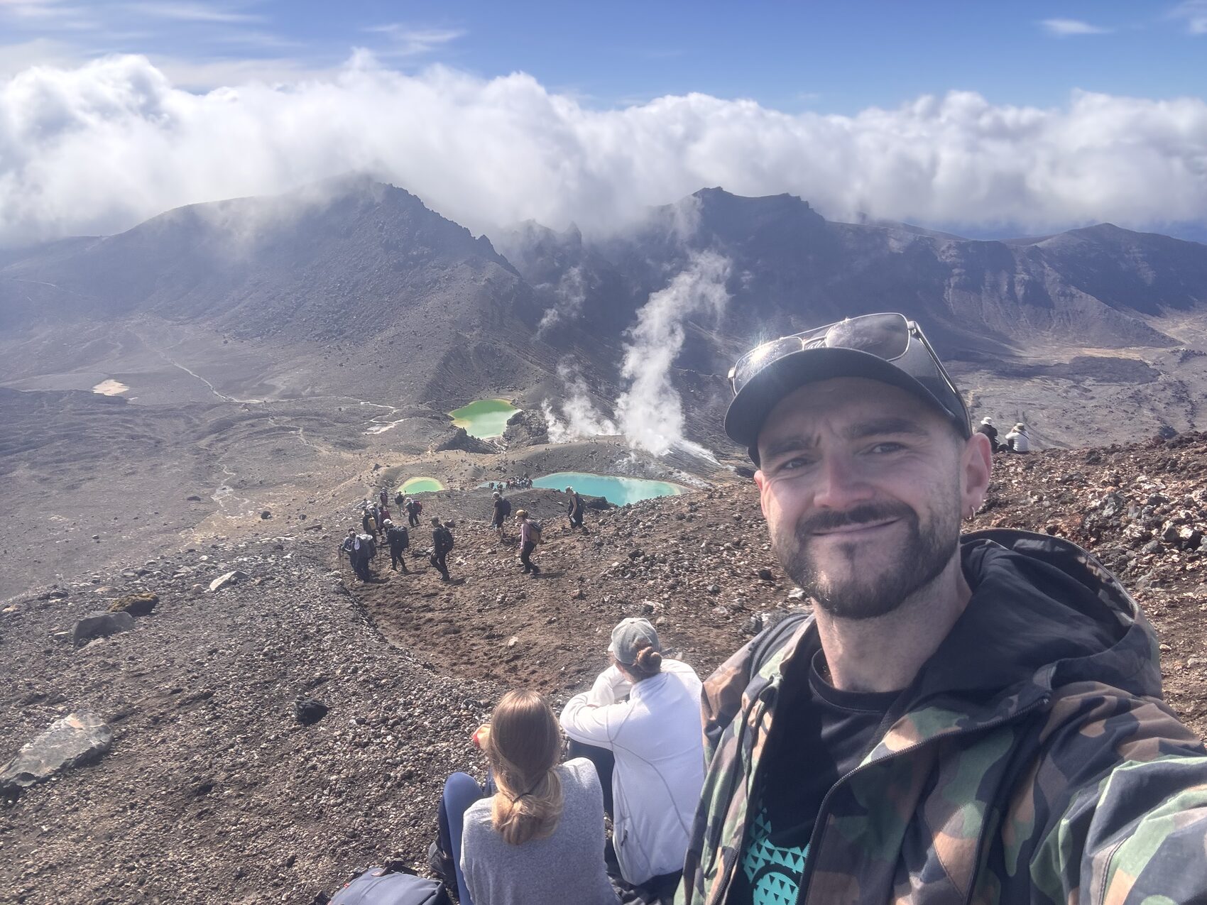 CEO Tom Leonard posing for a photograph in front of  a volcano in New Zealand&rsquo;s North Island