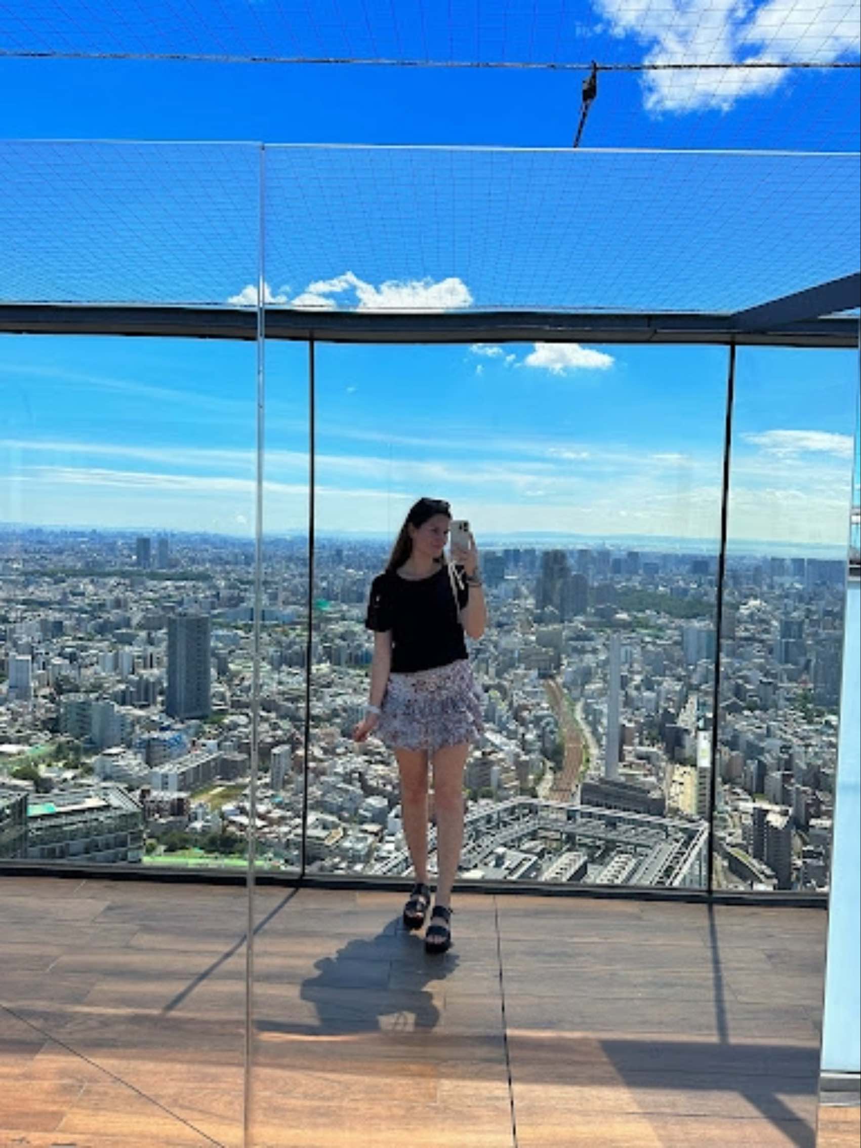 Swiss traveller Michelle Meyer standing on top of a tall building in New York