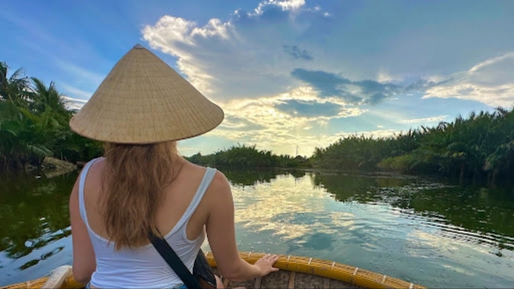 Swiss traveller Michelle Meyer looking out from a boat over water in Vietnam