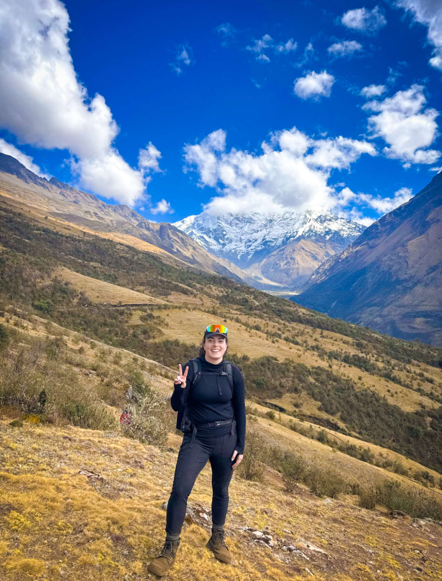 Traveller Jordan LoMonaco posing for a photograph on the Salkantay Trek in Peru