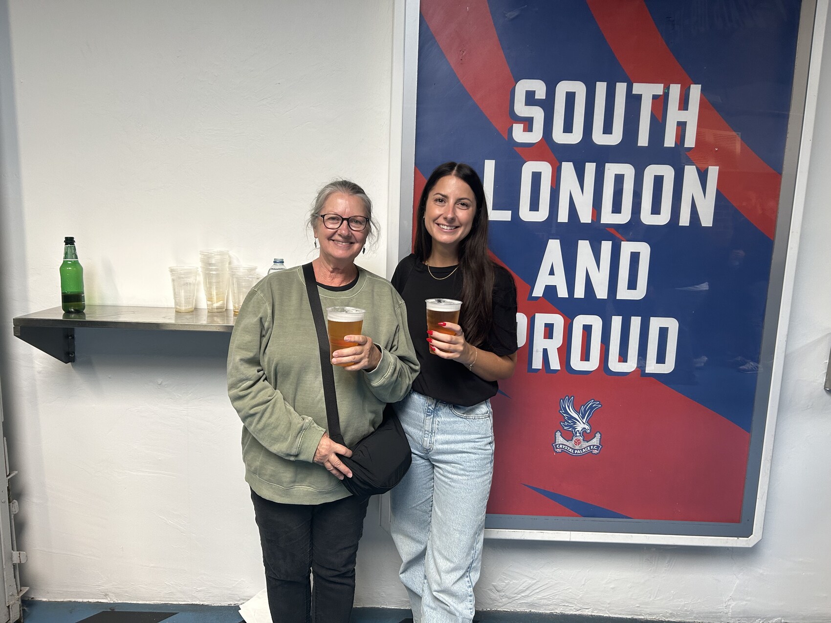 Rae Watt posing with her mum at Crystal Palace F.C.