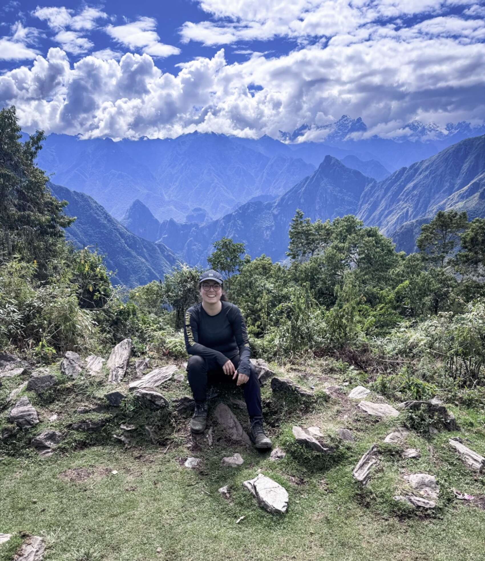 Traveller Jordan LoMonaco in front of mountains on the Salkantay Trek in Peru
