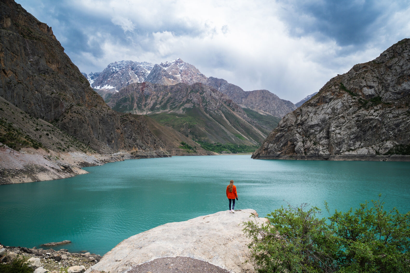 A woman standing in front of the Seven Lakes in Tajikistan