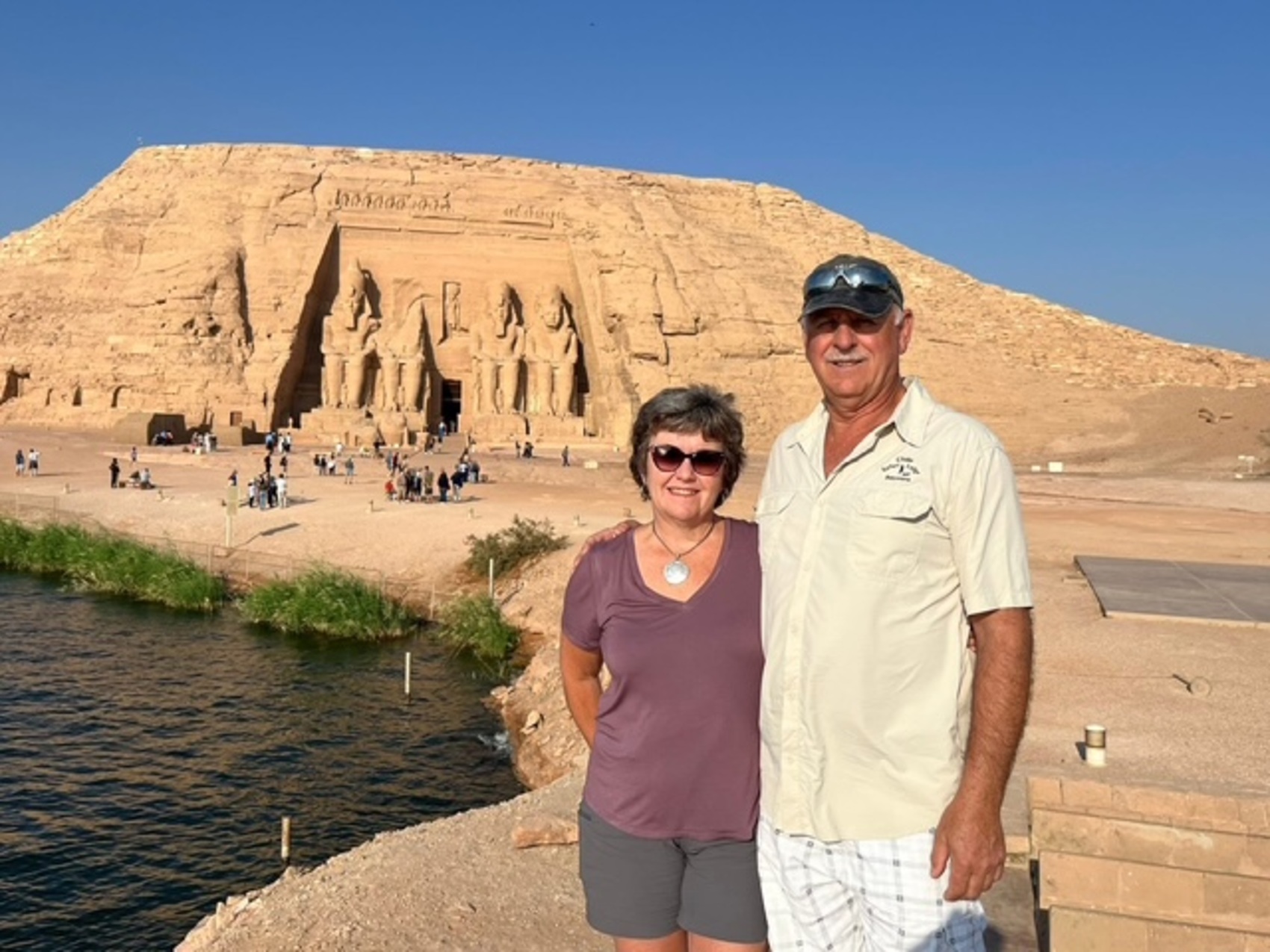 Judy and Blair a couple from Manitoba, Canada posing in front of the Great Temple at Abu Simbel in Egypt