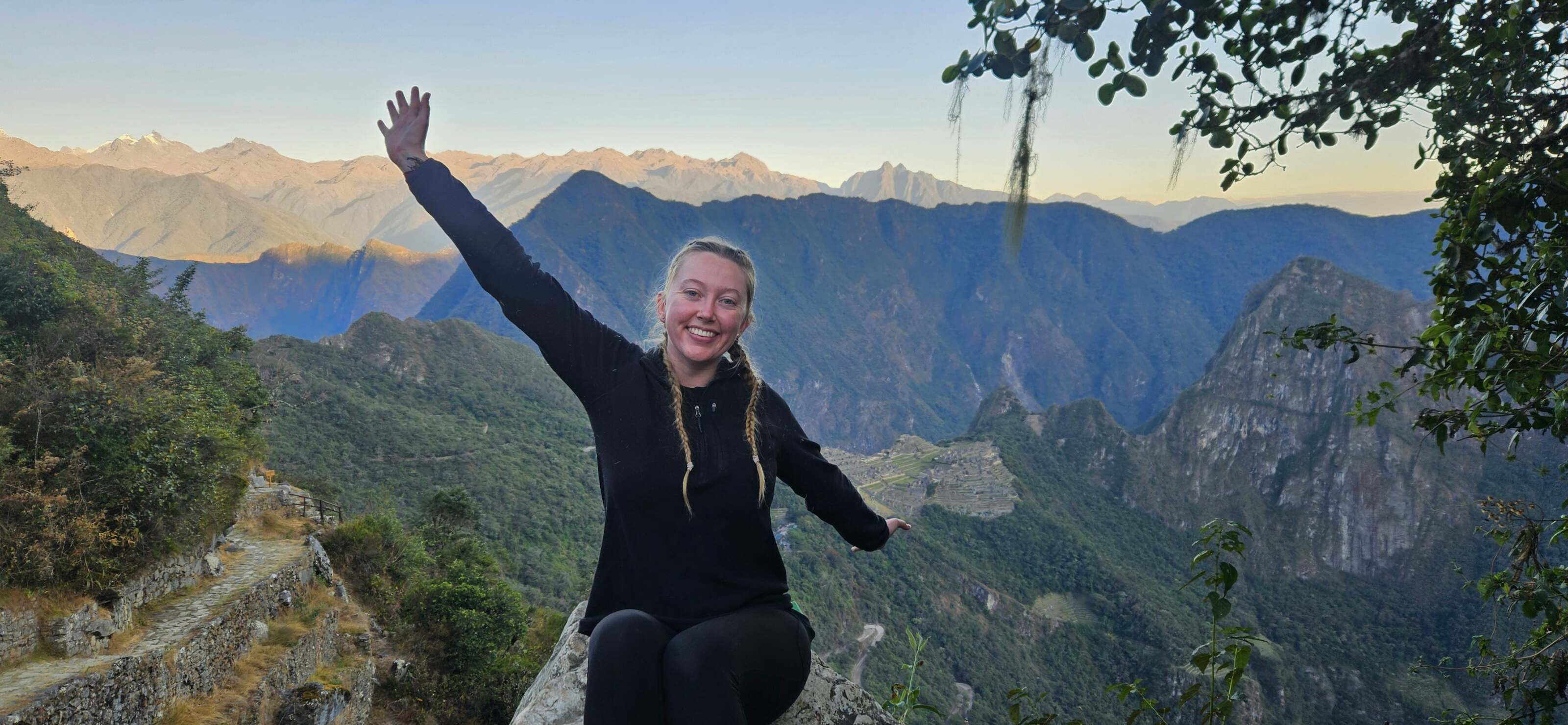 Traveller Milly posing for a photo in Peru near Machu Picchu