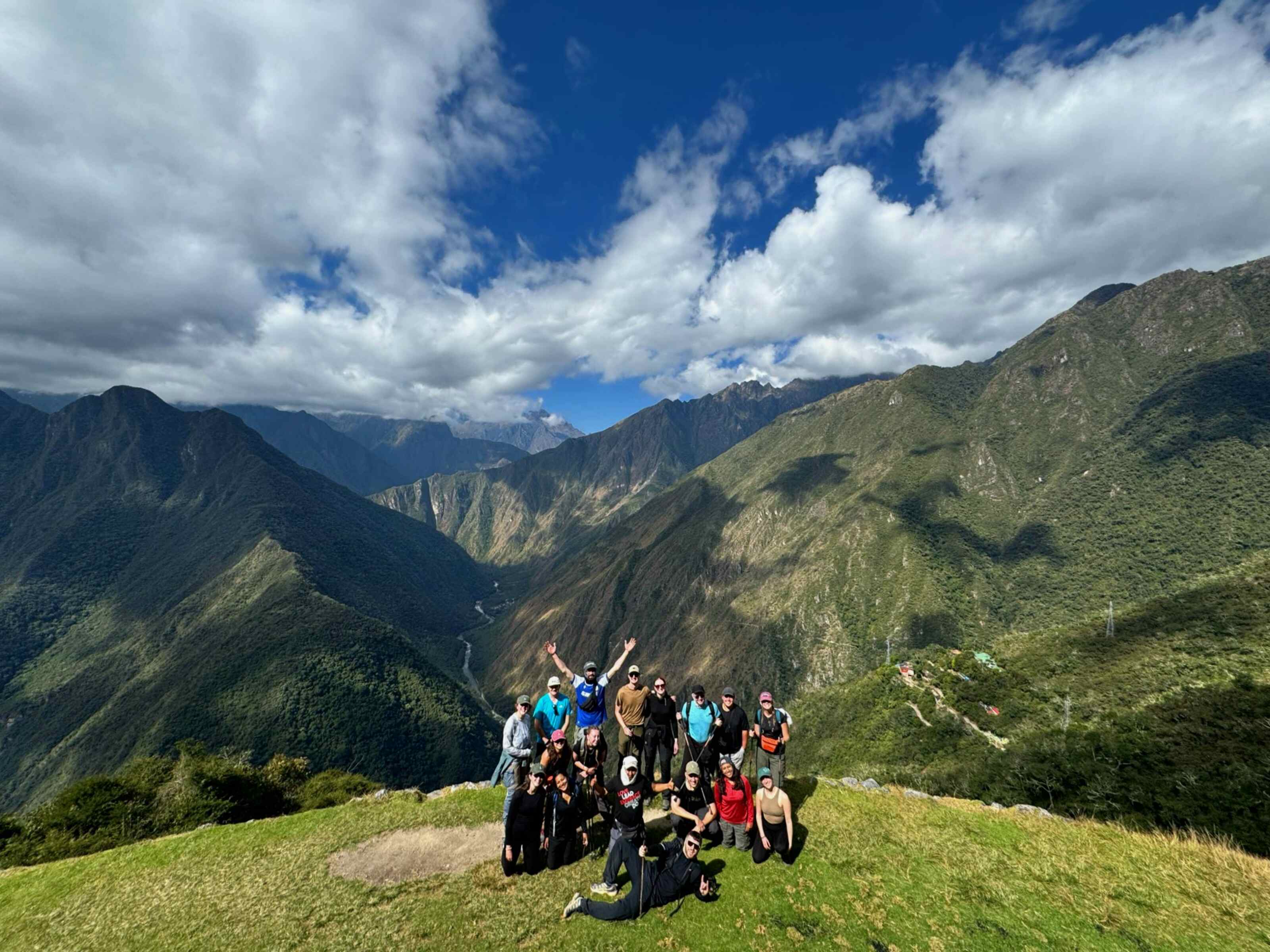 Traveller Milly from New Zealand with her group of fellow travellers posing for a picture in Peru