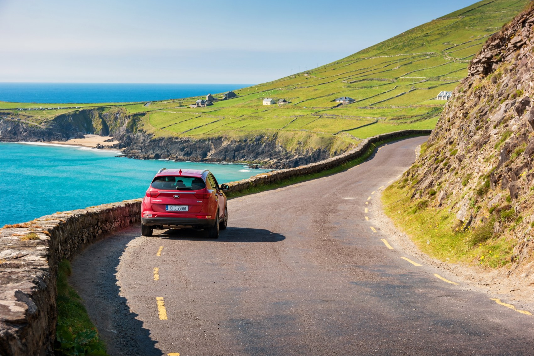A car driving down the Wild Atlantic Way in Ireland &mdash; benedek