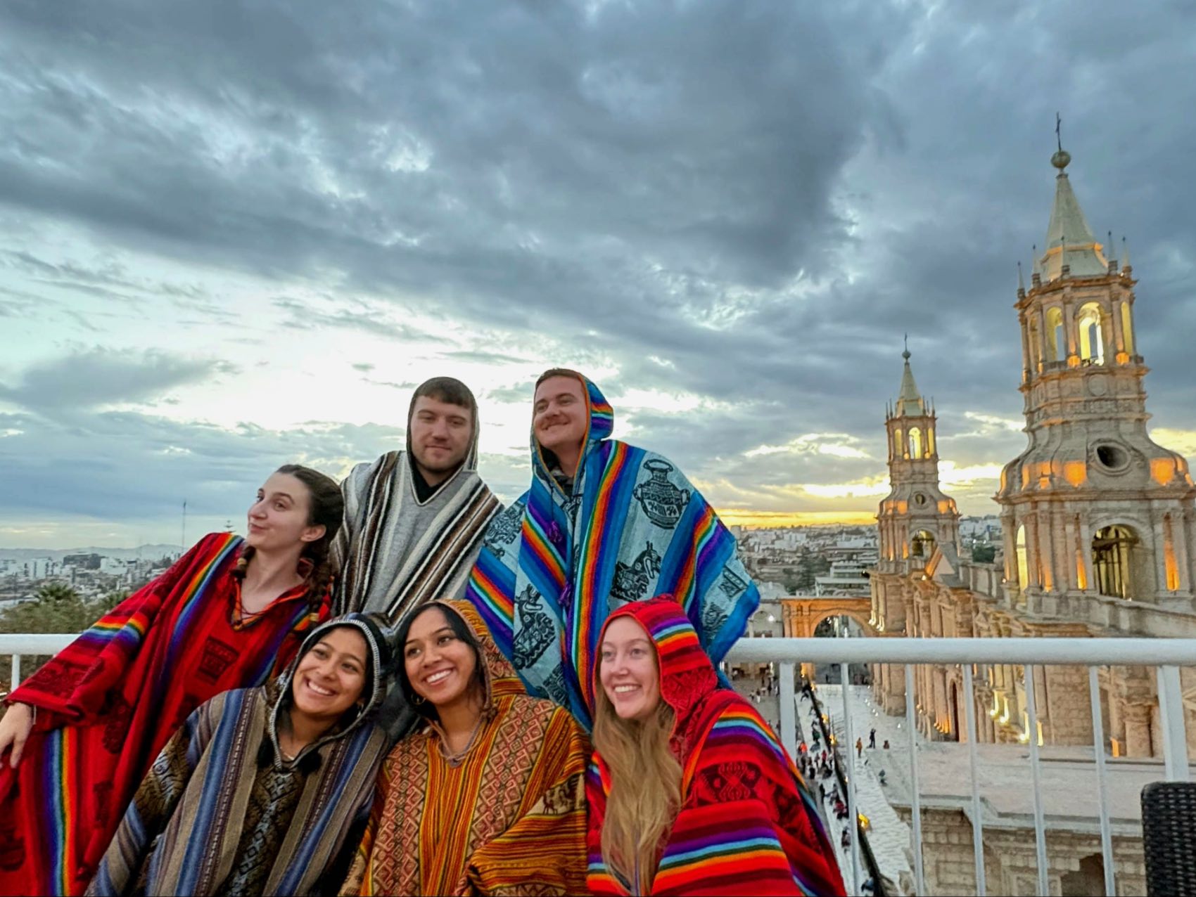 Traveller Milly posing for a photo in Arequipa, Peru with fellow travellers