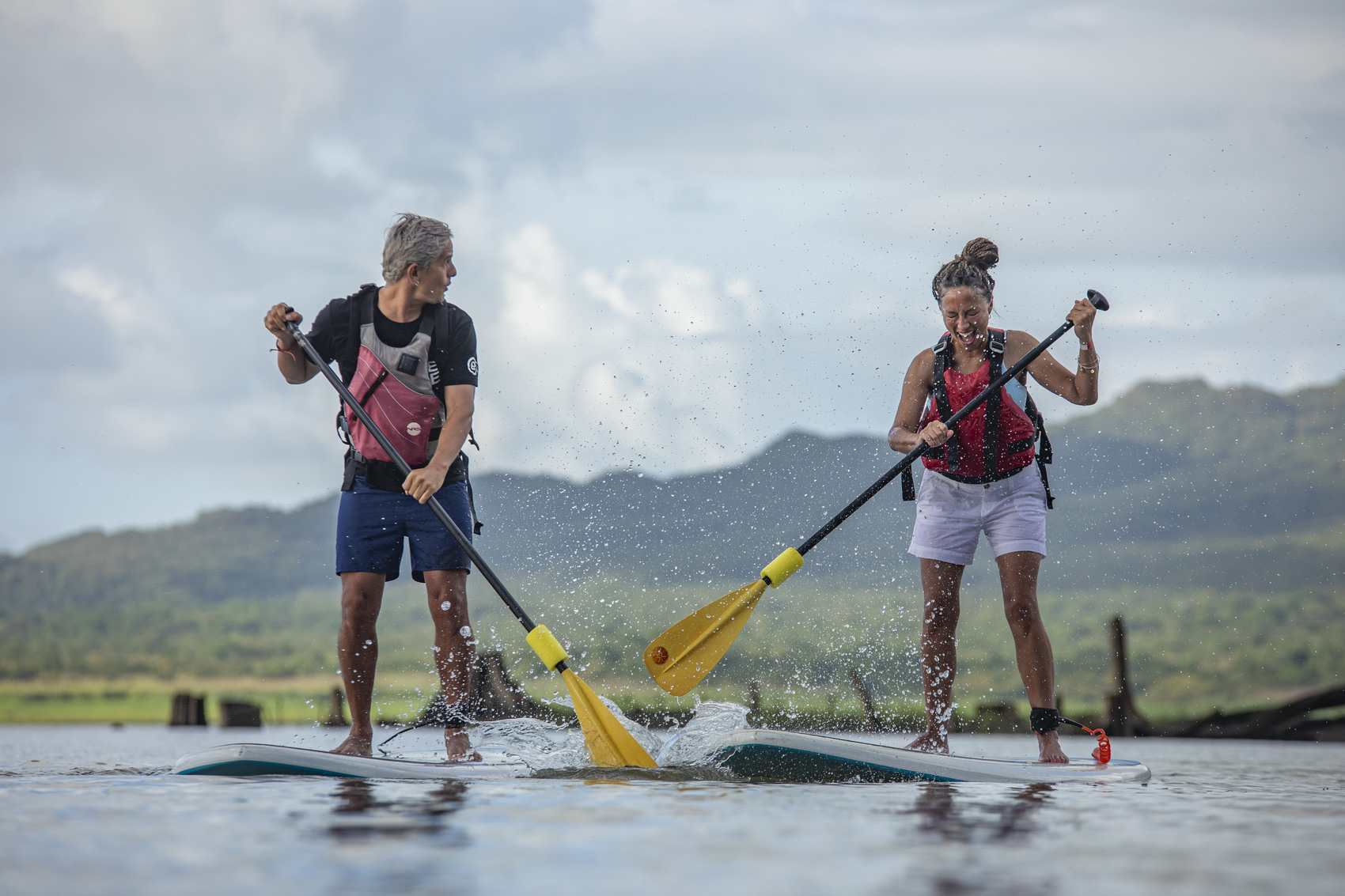 Two people going paddle boarding off Manuel Antonio Beach in Costa Rica — Shereen Mroueh