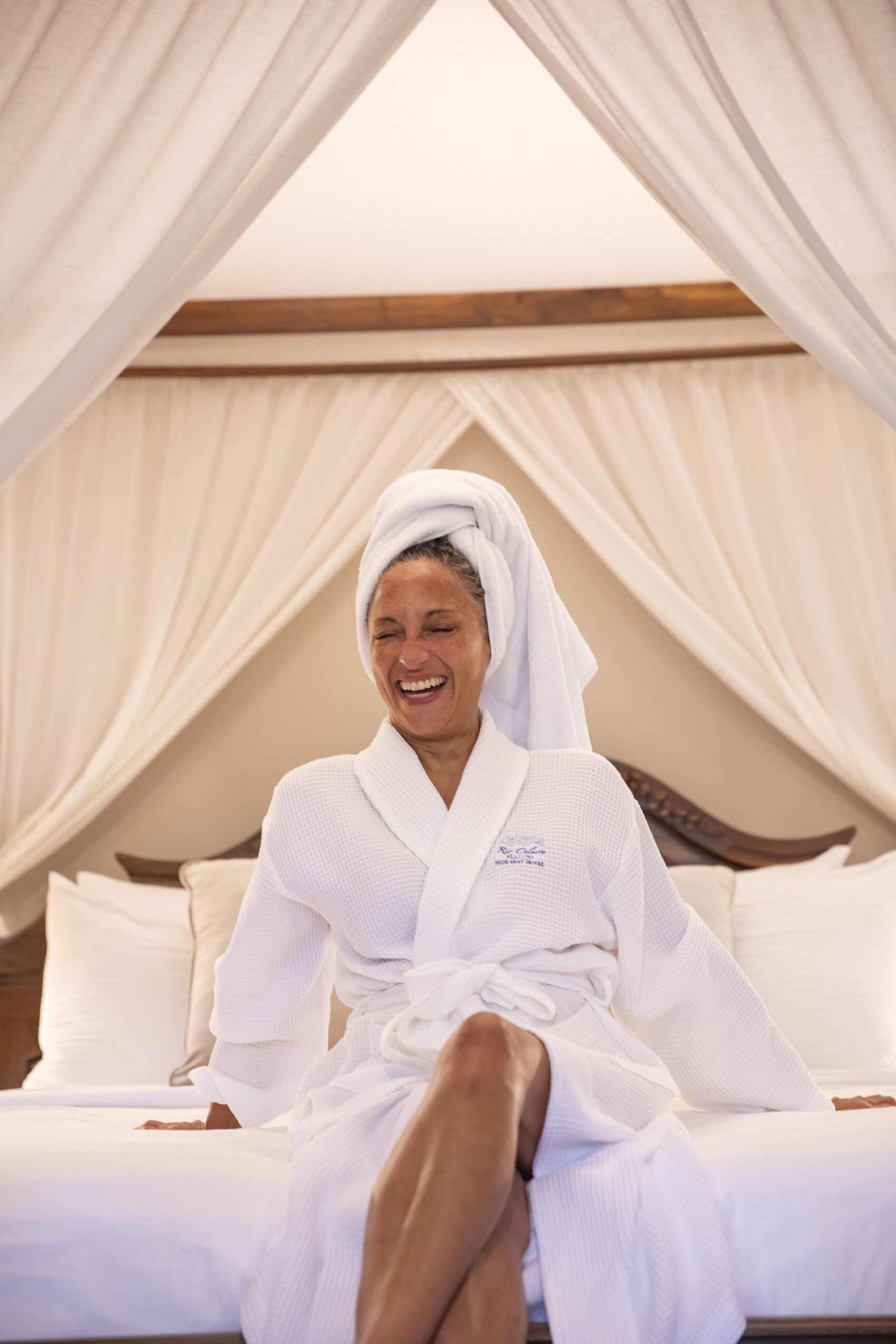 A woman sitting comfy in her hotel on a Geluxe tour — Shereen Mroueh