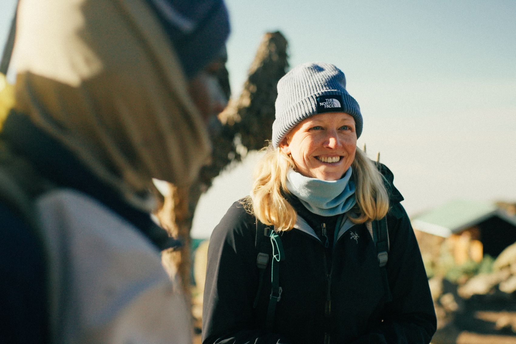 A picture of a smiling traveller on Mt. Kilimanjaro in Tanzania in Africa