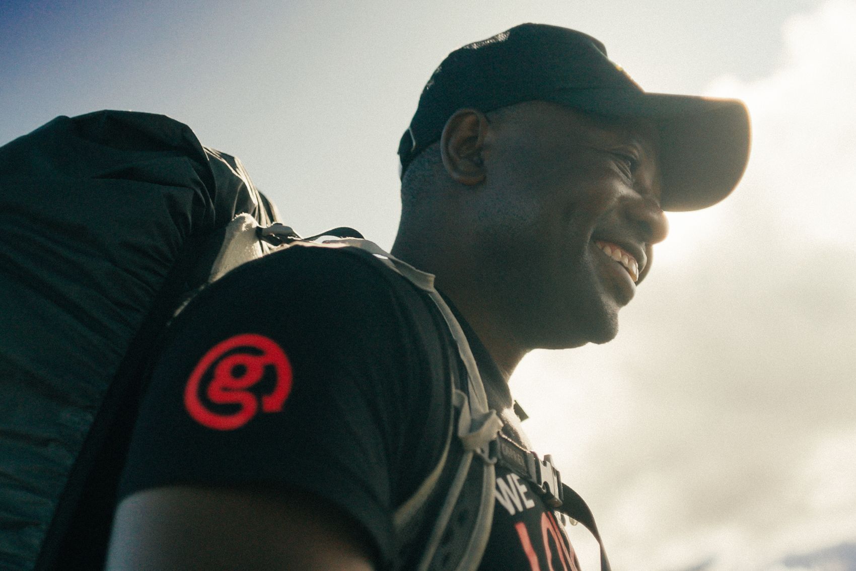 A picture of a smiling CEO on one of the Mt. Kilimanjaro tours