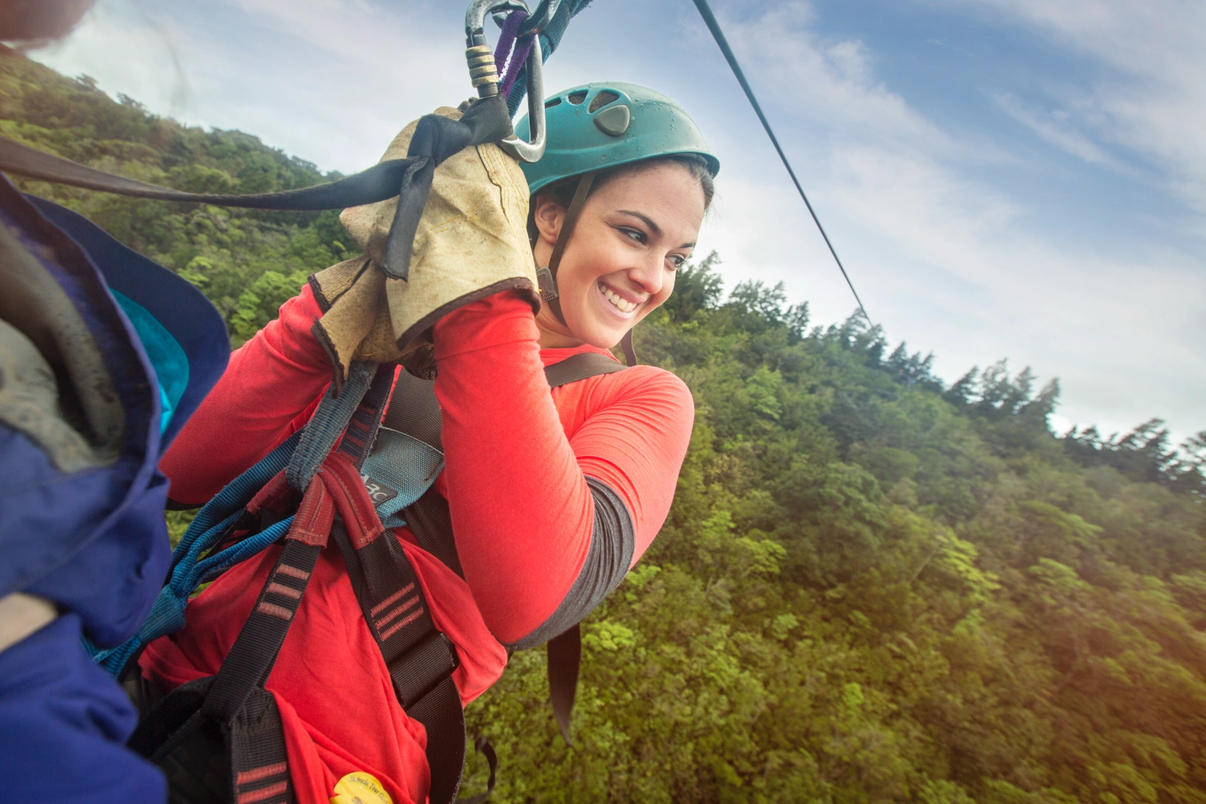 A woman traveller on a zip line in Costa Rica