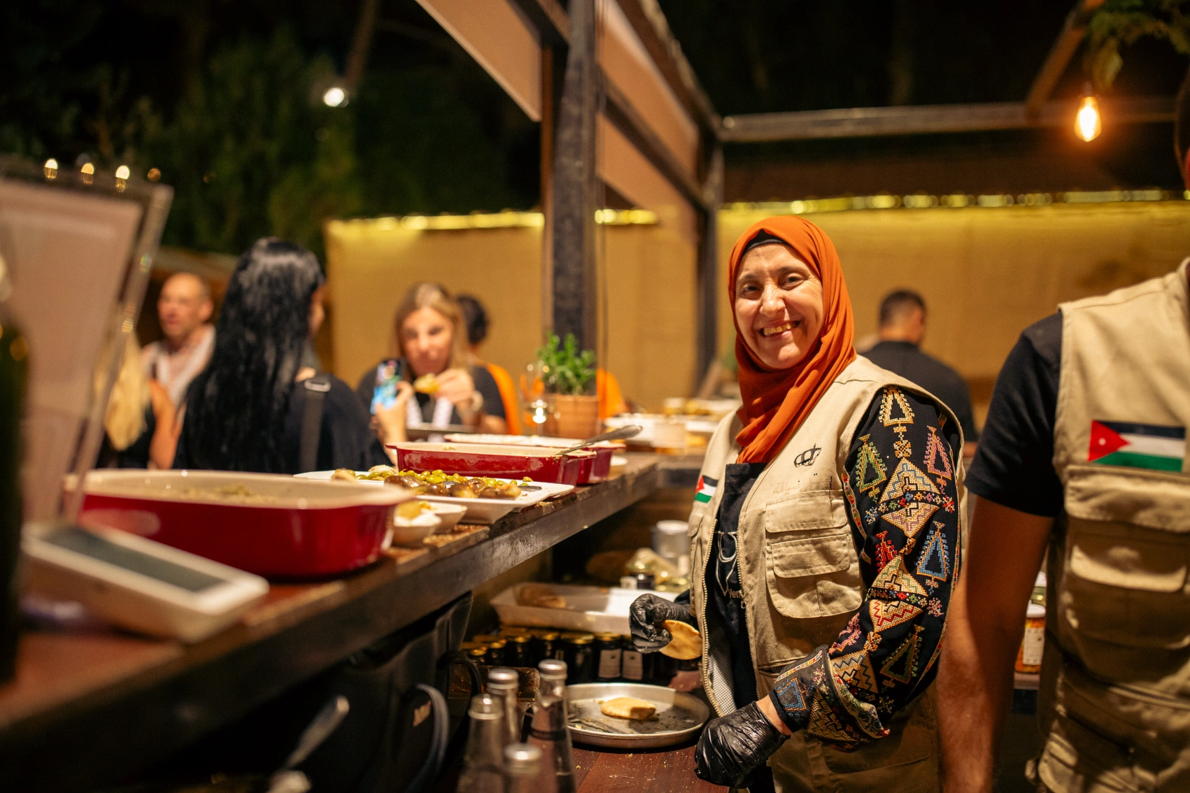 GX Jordan 2025 A woman serves food at a GX event in Jordan