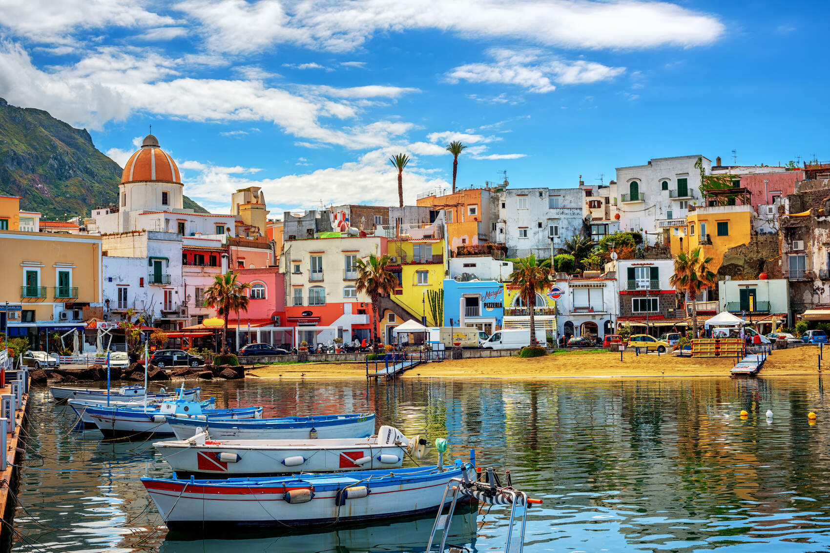 The colourful houses and boats of Iscia in Italy-Xantana