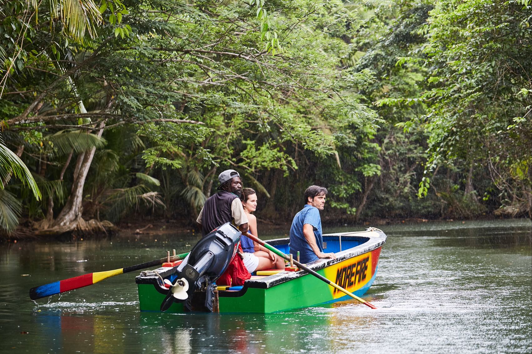 People being guided on a row boat down the Indian River in Dominica, the Caribbean