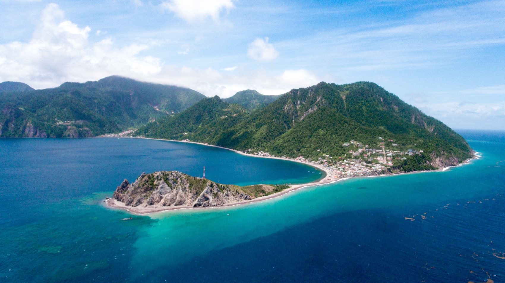 The headland of Scotts Head surrounded by the Caribbean Sea in Dominica, the Caribbean