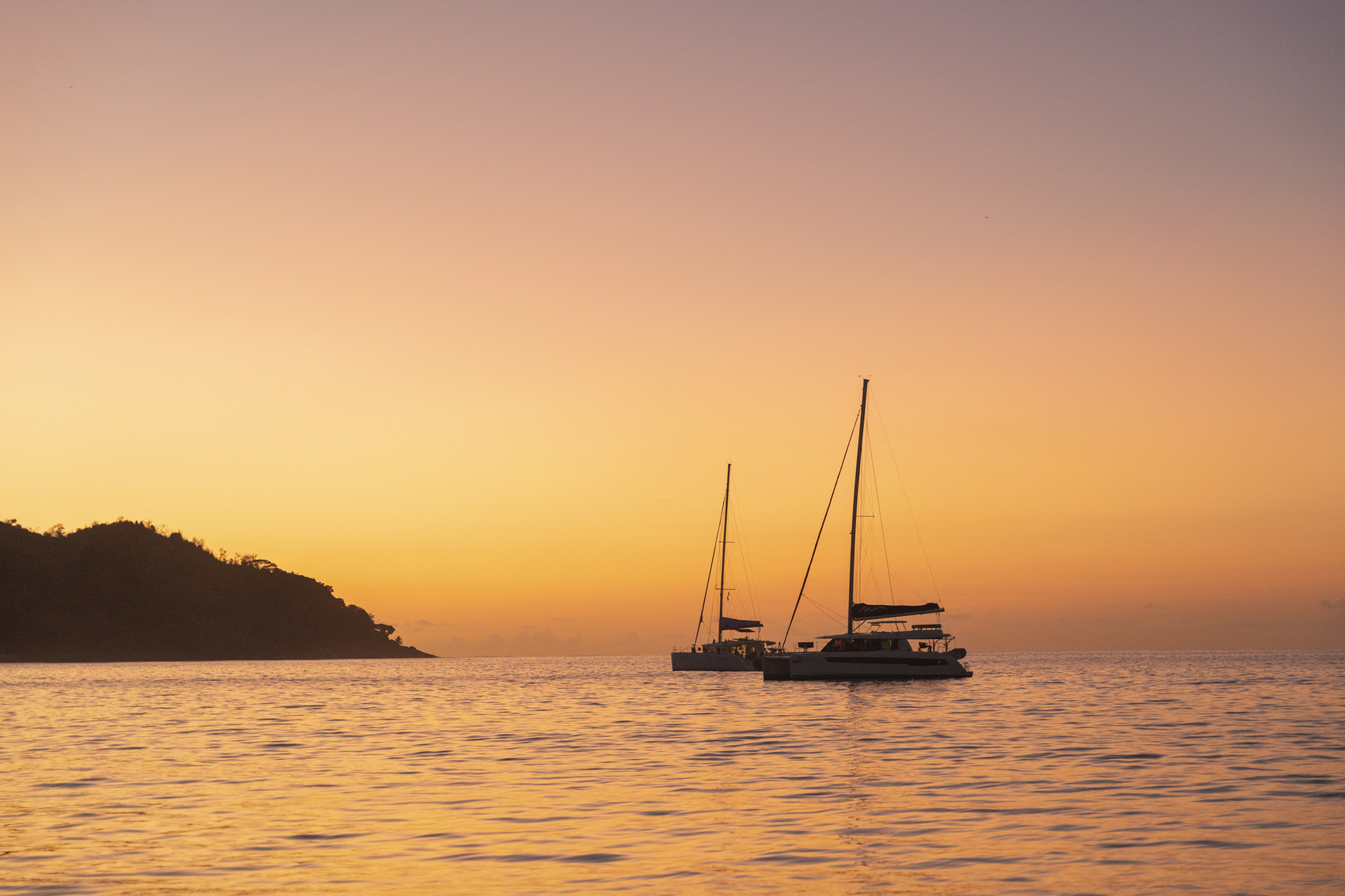 Two catamarans as the sun is setting in the Seychelles — AscentXmedia