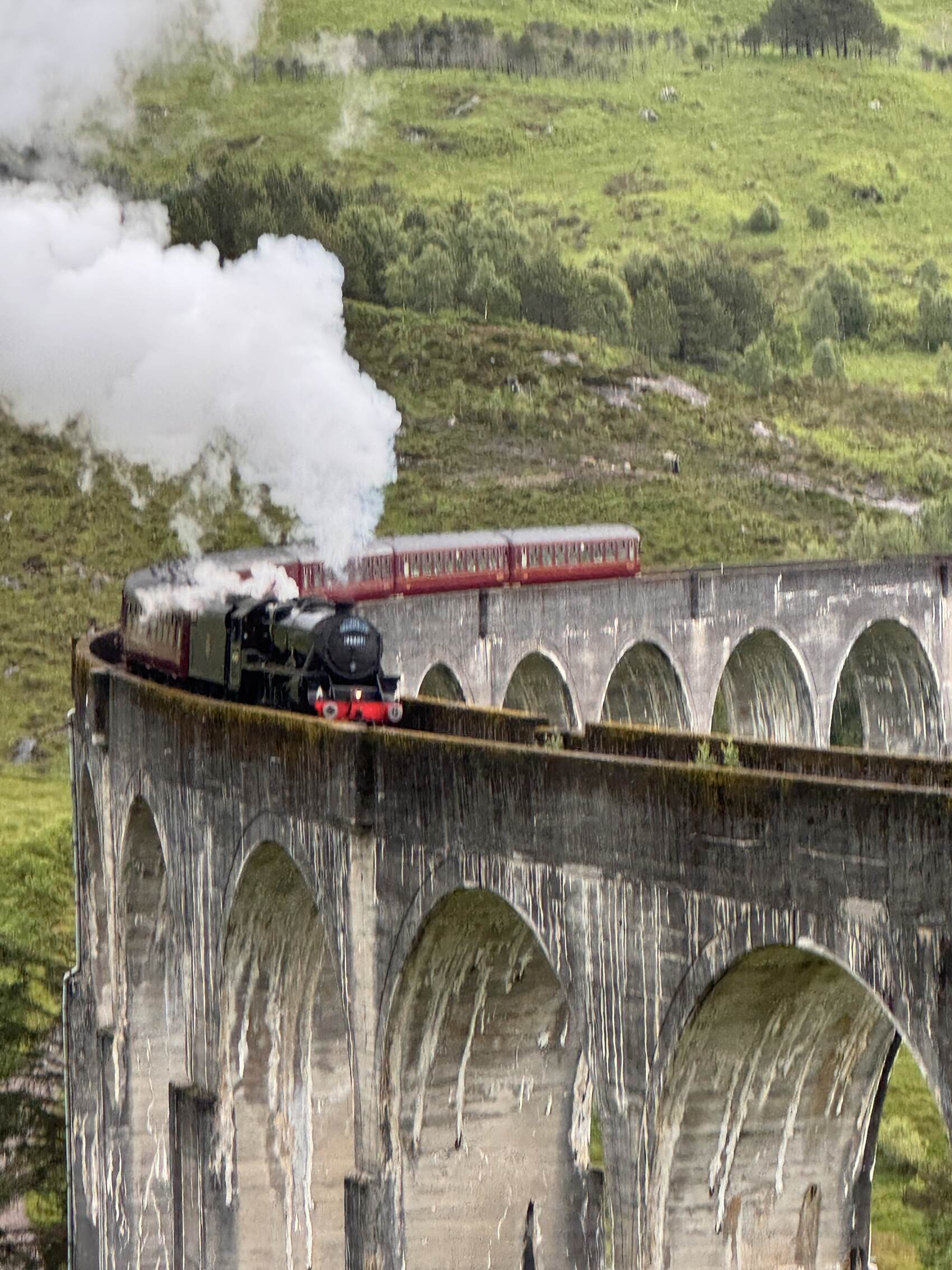 The famous Hogwart’s Express crossing the Glennfinnan Viaduct in Scotland