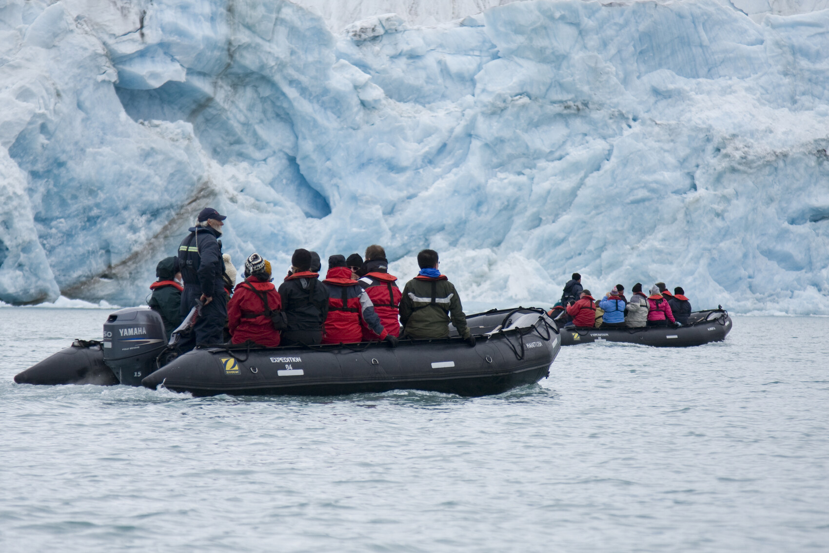 A group of travellers with an expert doing conservation research in Antarctica