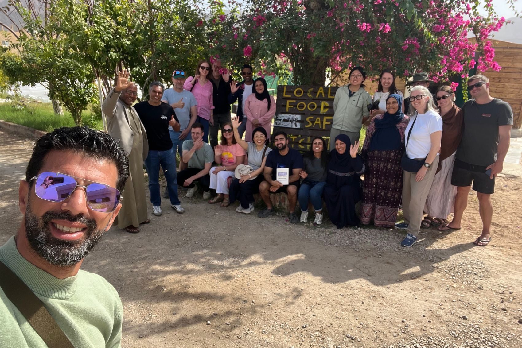CEO Wael Amira posing for a photograph with travellers in Jordan