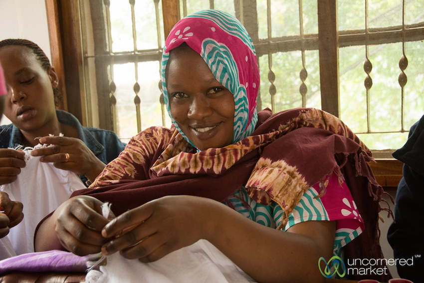 Women prepare crafts for sale at a Planeterra Project in Moshi, Tanzania. Part of the proceeds go toward adult education for women.