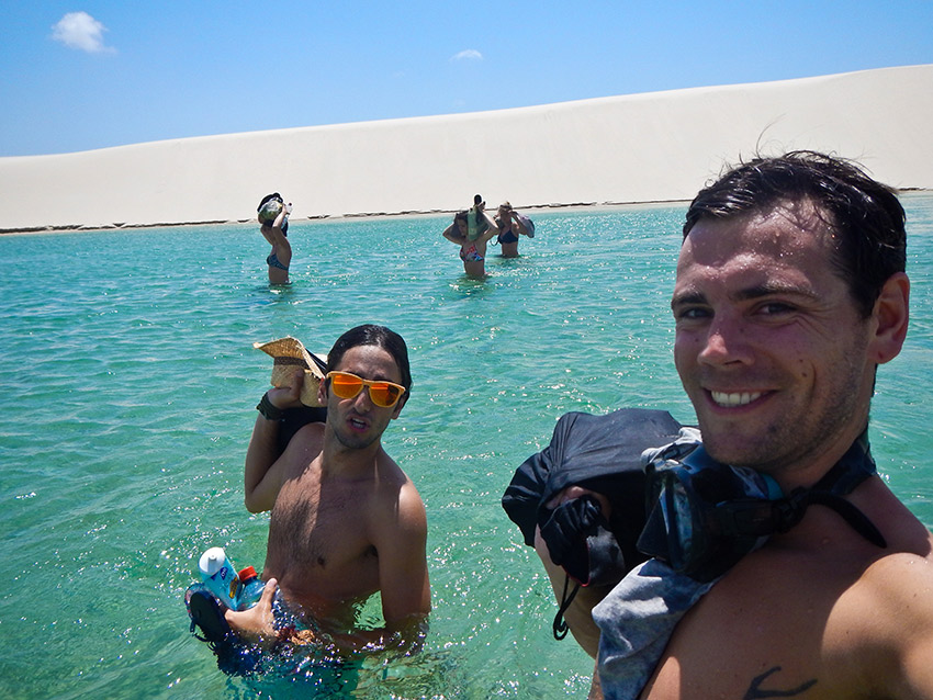 Keeping our gear dry, crossing the pool of fresh water.