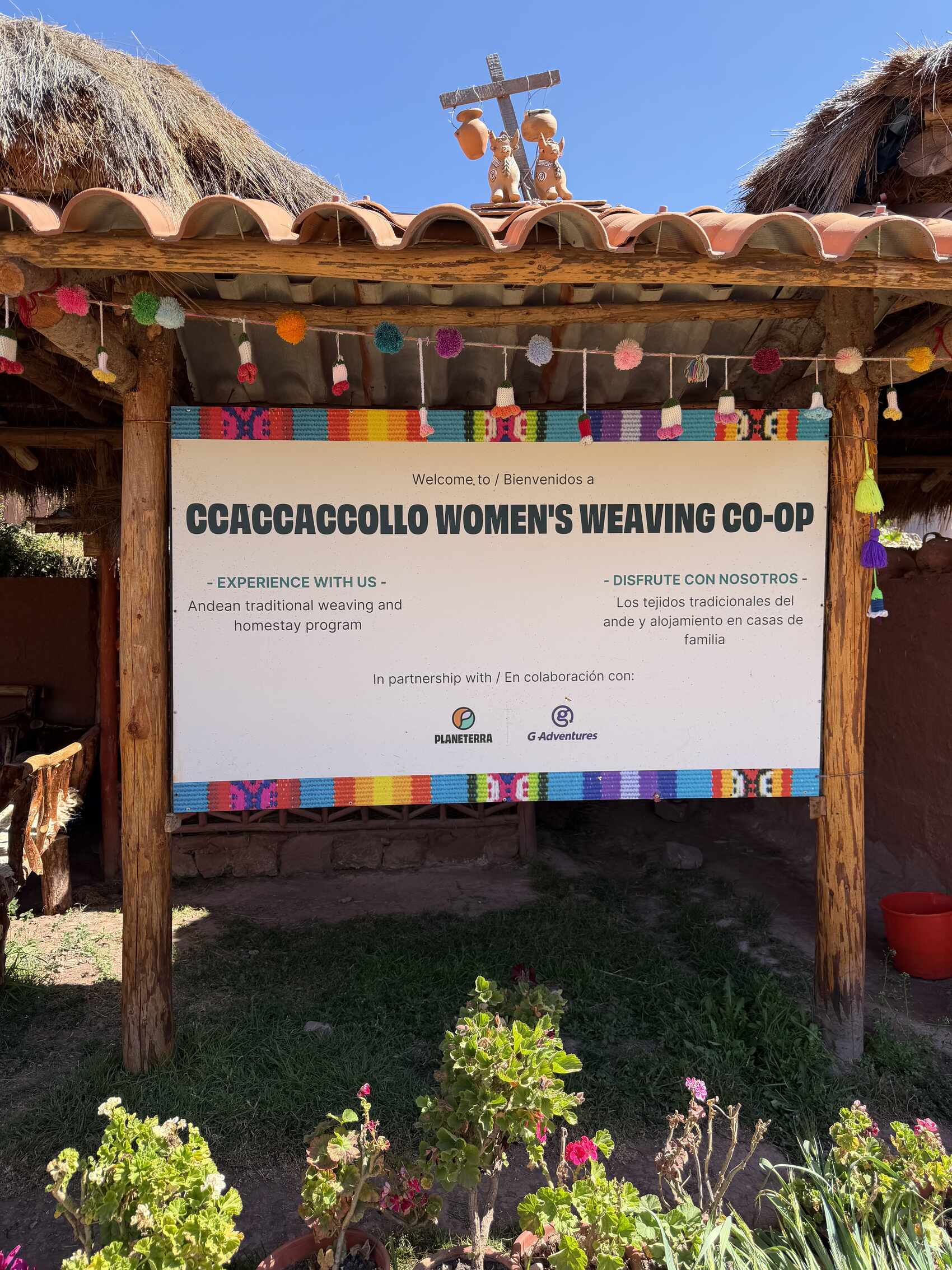 A sign outside the Ccaccaccollo community weaving workshop in Peru