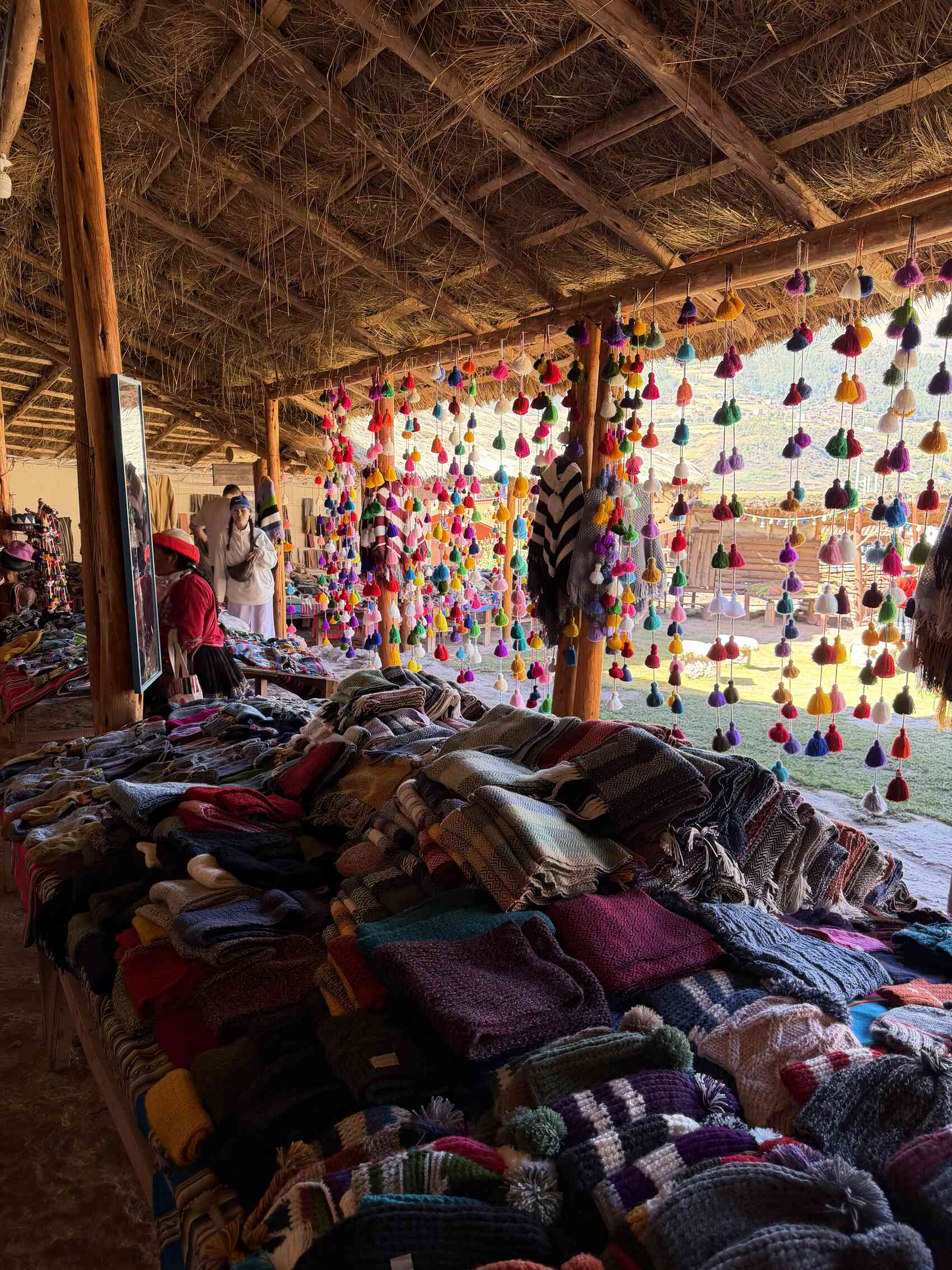 Various different woollen products at the Ccaccaccollo community weaving workshop in Peru