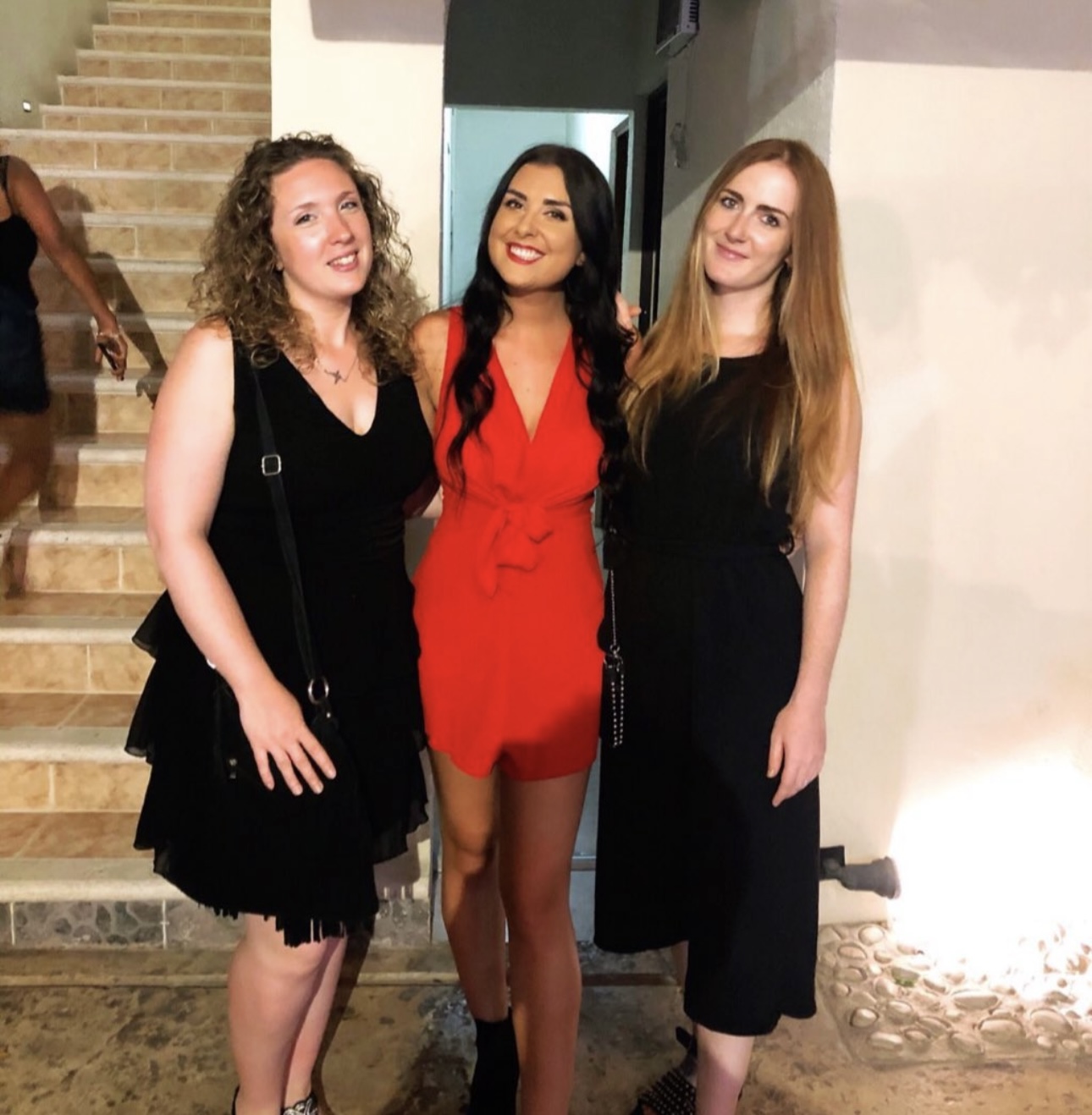 Jessica, Abbie, and another friend posing for a photograph