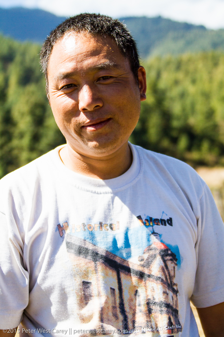 nepalese farmer poised serious.