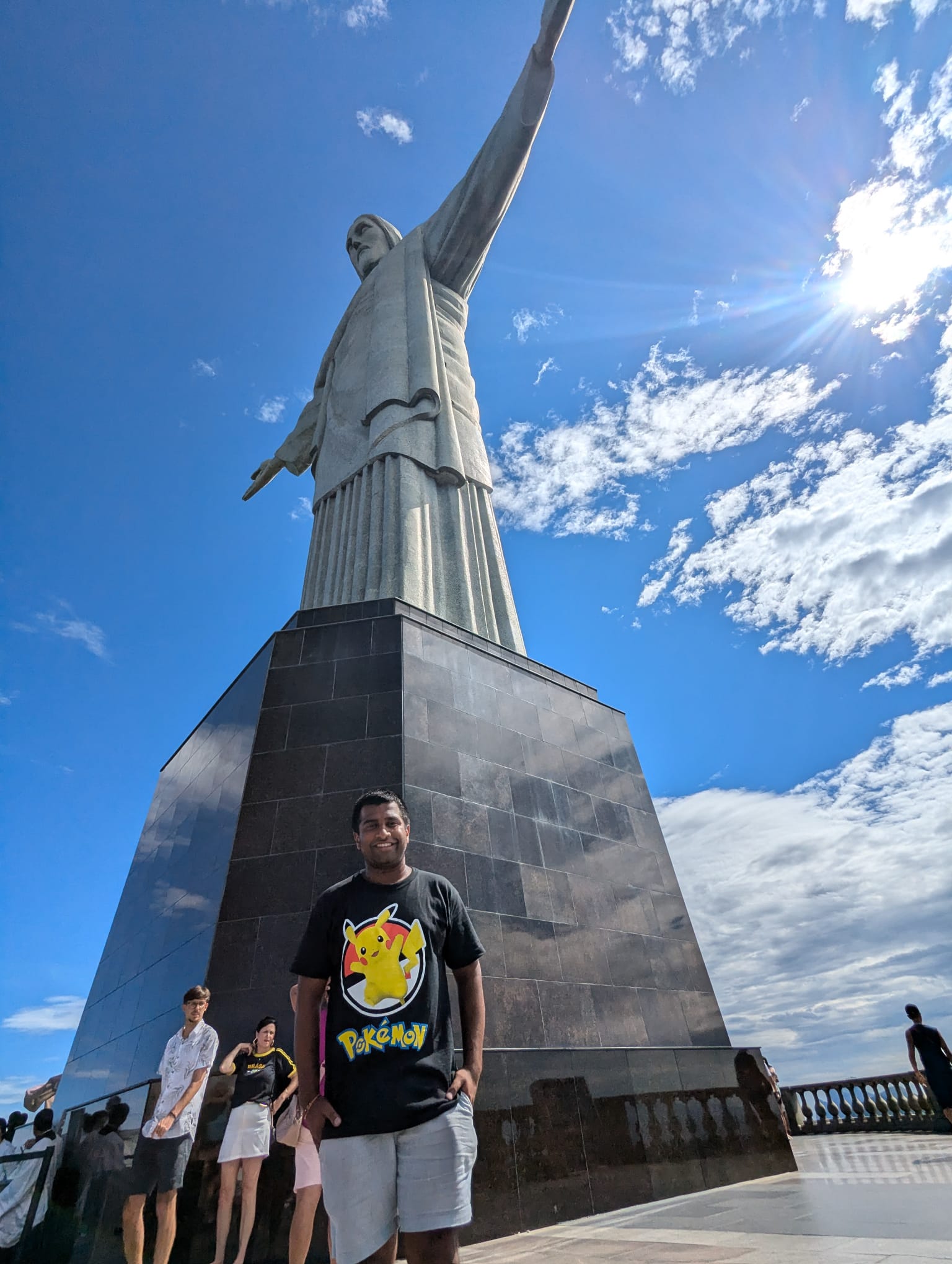 Traveller Ritesh posing for a photograph in front of Christ the Redeemer in Rio