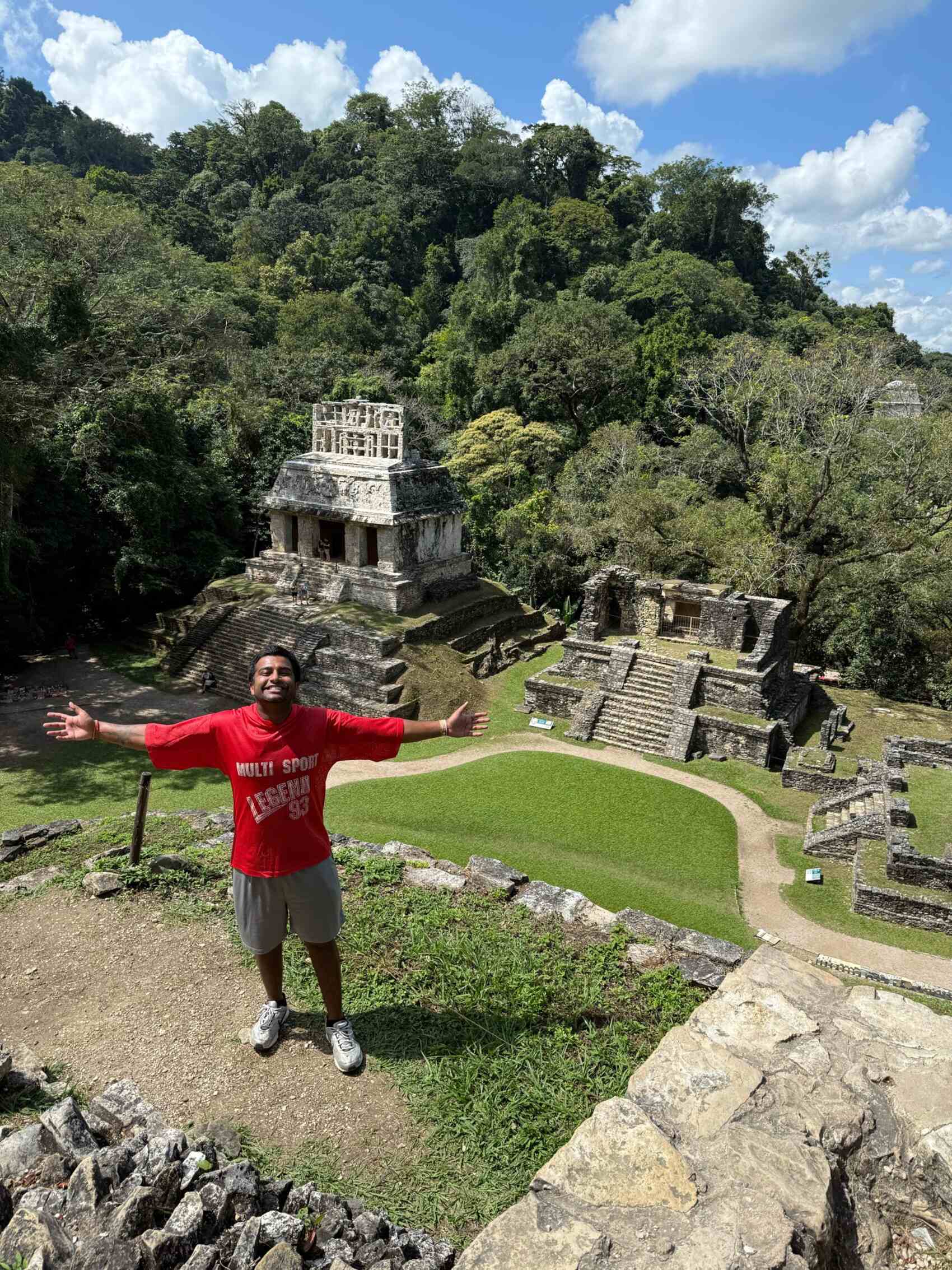 Ritesh Maharaj posing for a picture in front of ruins in Central America